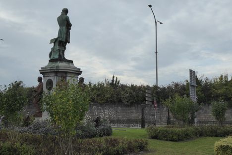 The wall opposite the monument.