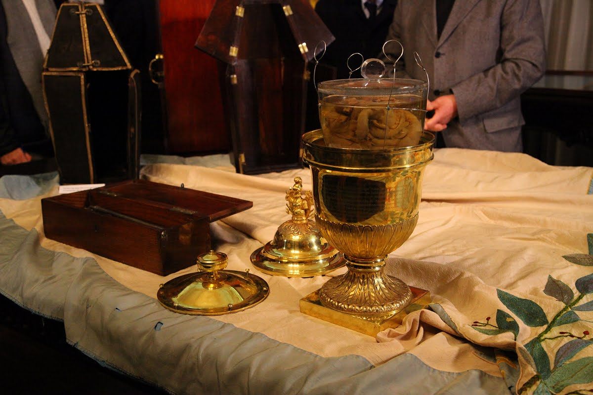The heart is preserved in formaldehyde, inside a glass jar, inside a silver vase, inside a golden urn, inside a mahogany coffin.