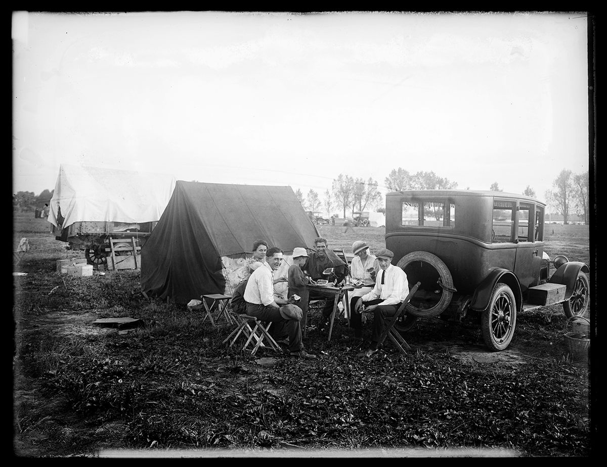 A group of dapper campers share a watermelon on the National Mall in Washington, D.C., circa 1921. The Ford Model T was built with size in mind. According to Henry Ford, the pioneering design was “large enough for the family, but small enough for the individual to run and care for." The built-in trunk—a first for automobiles at the time—allowed tents, cots, and other gear to share space with a family on long road trips.