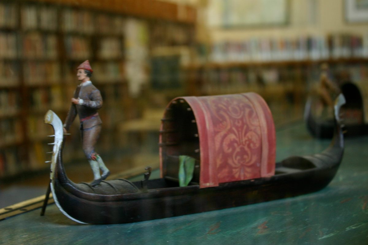 Book shelves in the background of the intricate Doge's Palace diorama.