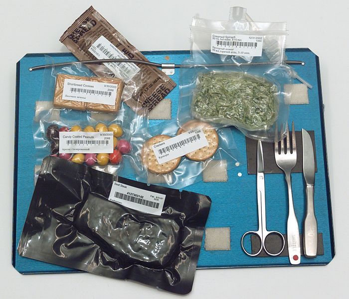 2003 Bags of International Space Station food and utensils on tray.