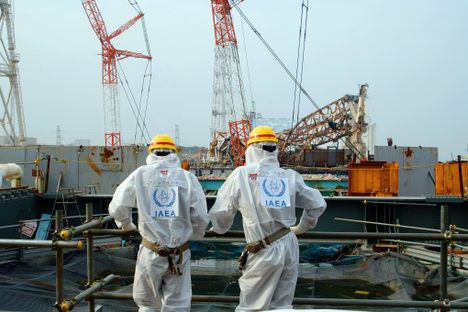 TEPCO workers overlook the Fukushima site in 2013.