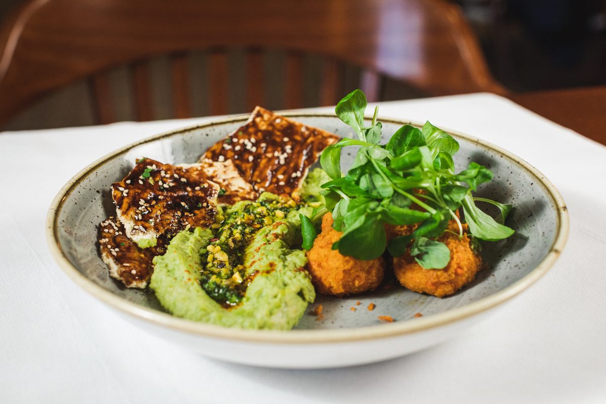 Colonial cooks made carrot puffs, served here with a modern addition of pea hummus and pistachio-and-carrot pesto, to use deteriorating vegetables at the end of the season.