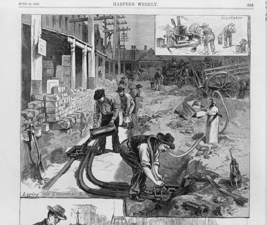 An illustration from June 21, 1882, of laying the tubes for electric wires in the streets of New York City, in order to wire houses 