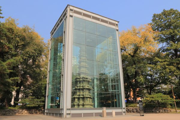 Wongaksa pagoda is encased in a protective glass structure in Tapgol Park.