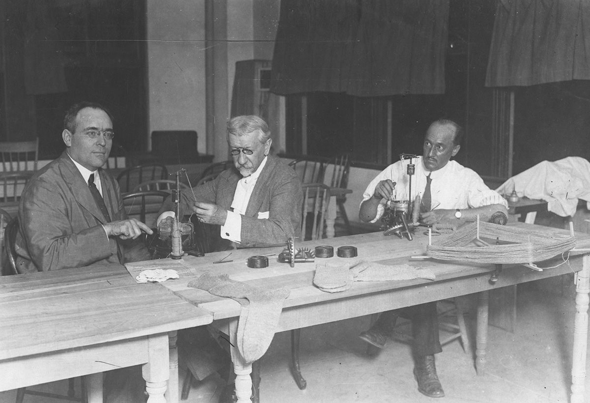 Men knitting for the Red Cross, 1917.