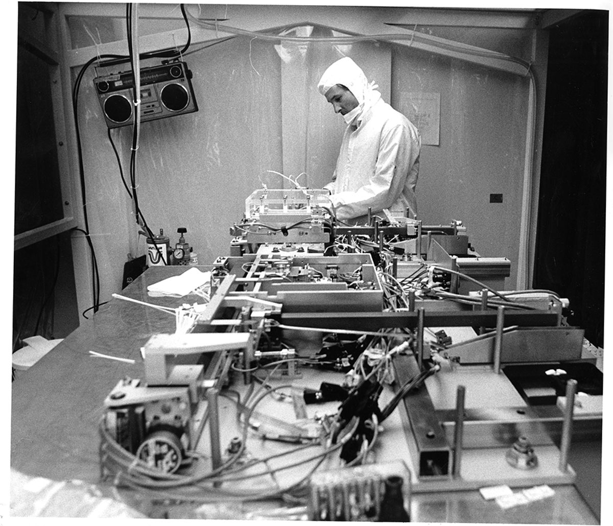 May 29, 1990: An Etec Systems employee works in a clean environment on a semiconductor assembly line.