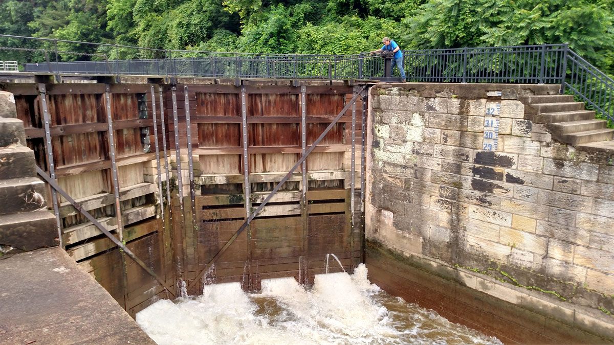 Curtis opening a valve on the lock. 