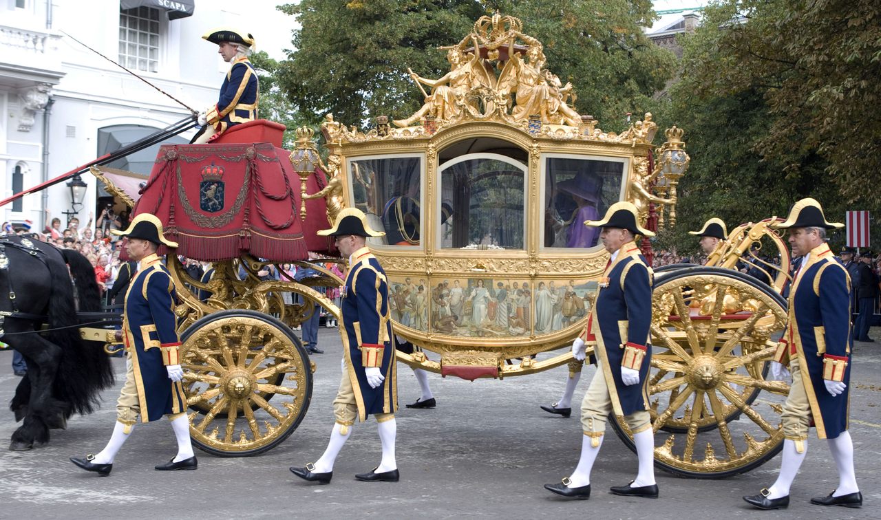 The Golden Coach, pictured here moving through The Hague, has inspired conversations about what to do with artifacts of the colonial era. 