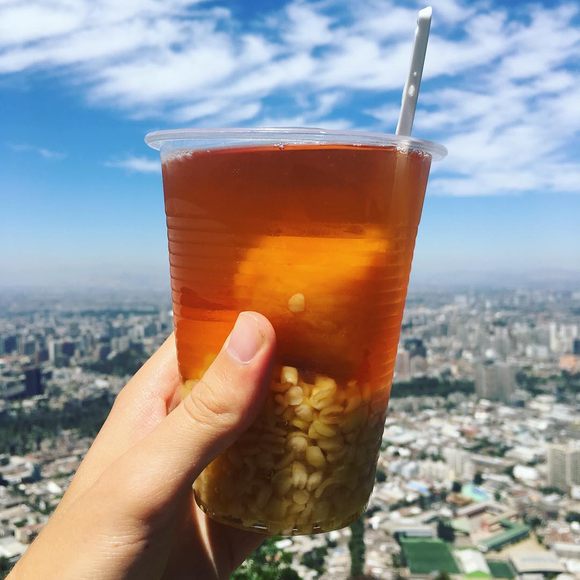 A cup of mote con huesillos pairs especially well with panoramic views of Santiago.