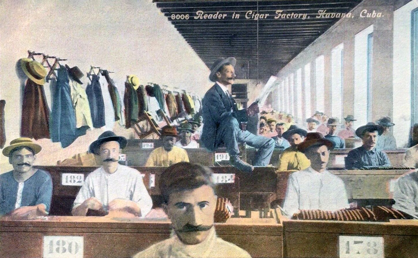 A circa 1907 postcard of readers in a cigar factor in Havana, Cuba