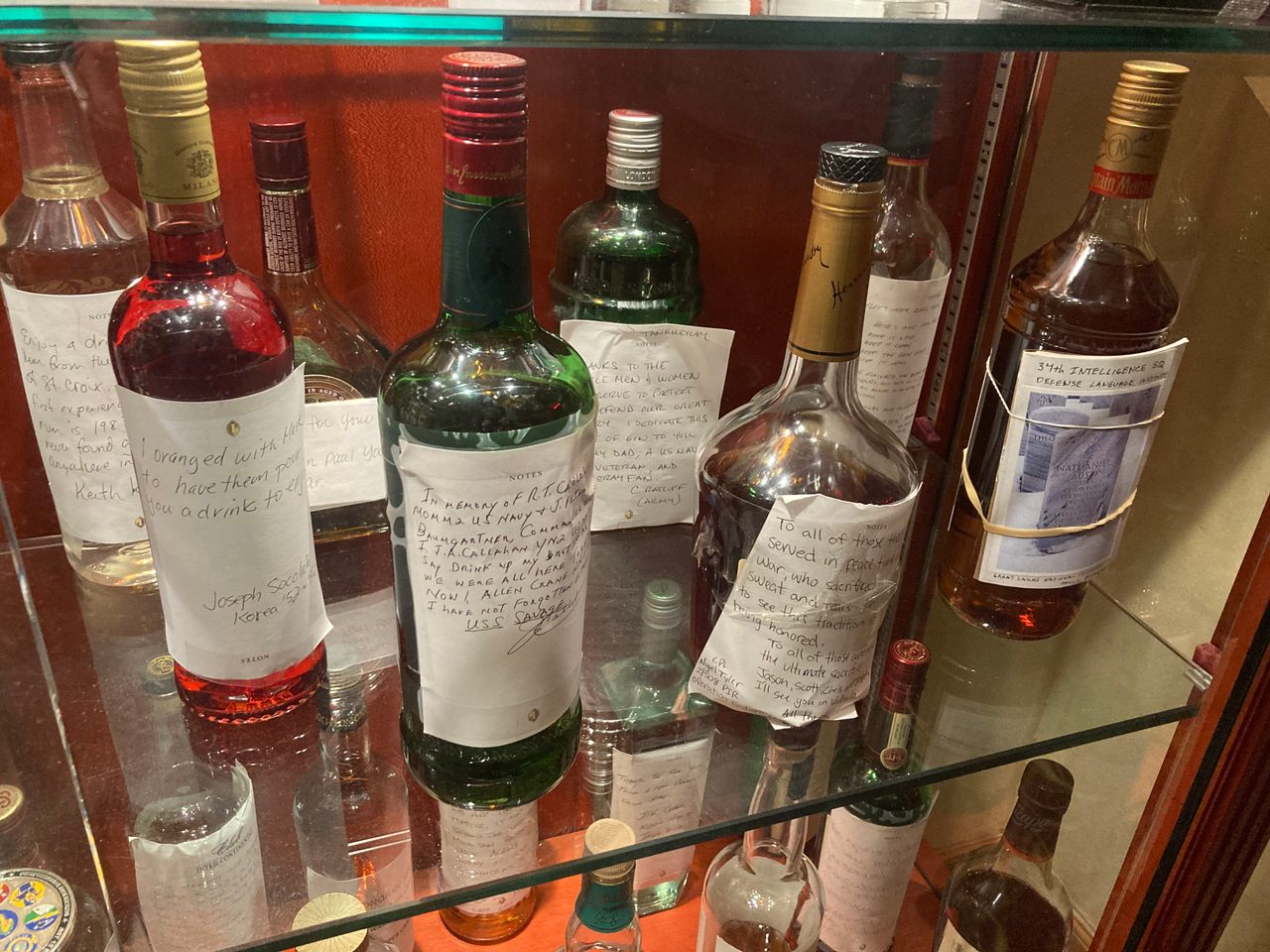 Bottles range from bourbon to whiskey to gin.