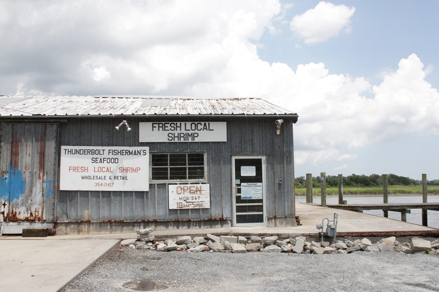 Thunderbolt Fisherman's Seafood, a shrimp packing house in the heart of Thunderbolt that predates World War II, waiting for the only shrimp boat of the week to come in, in early August 2018.