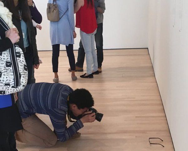 A MOMA visitor enjoys the new exhibit.